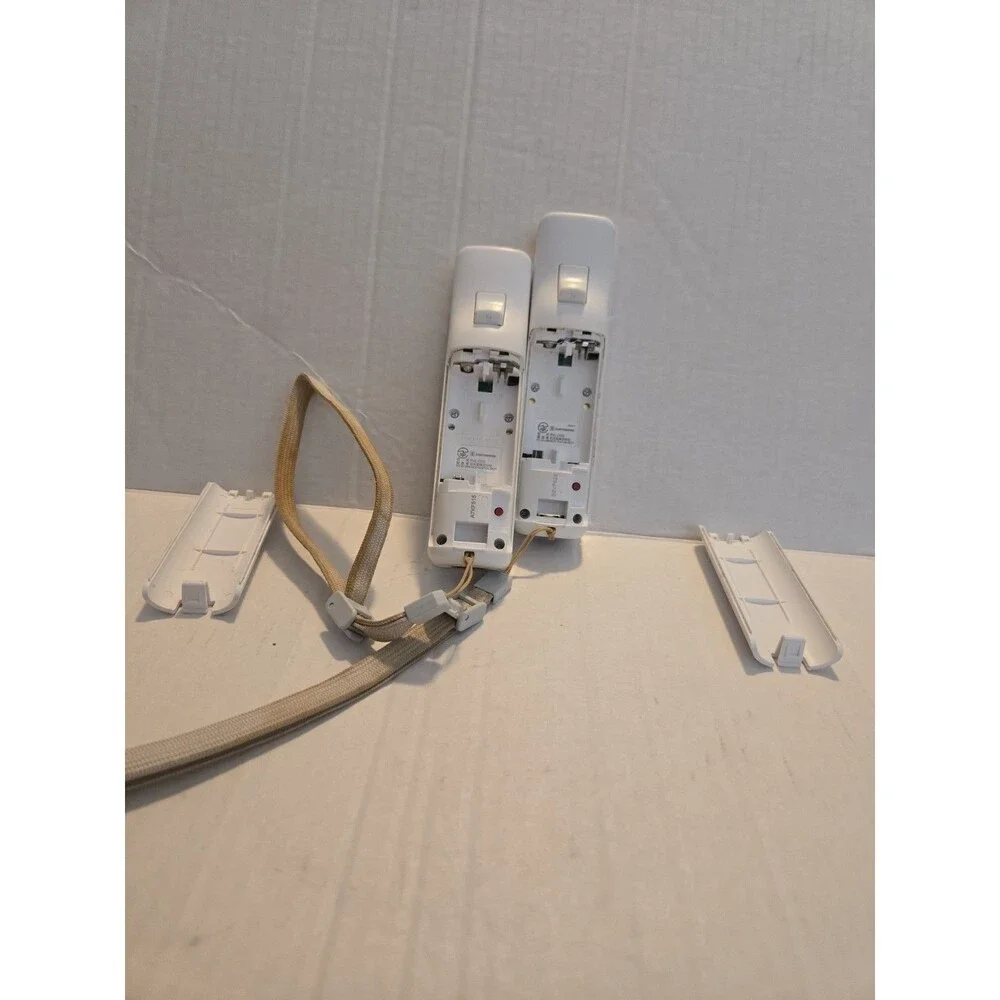 Pair Of Nintendo Wii Remotes With Nunchucks